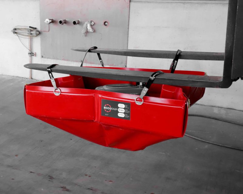 Red industrial tray attached to forklift tines.