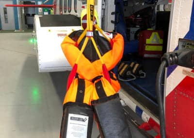 Rescue mannequin suspended in a helicopter.