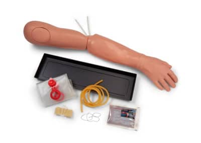 Medical training arm with accessories for injection practice.