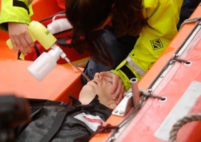 Medical emergency training with first aid on boat.
