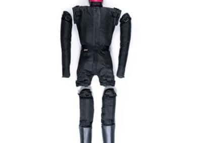 Boxing grappling dummy with black suit and pink head.