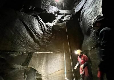 Cave rescue with stretcher and rope.