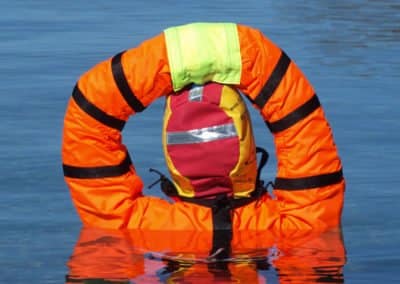 Manikin Person in lifejacket performing water rescue training.