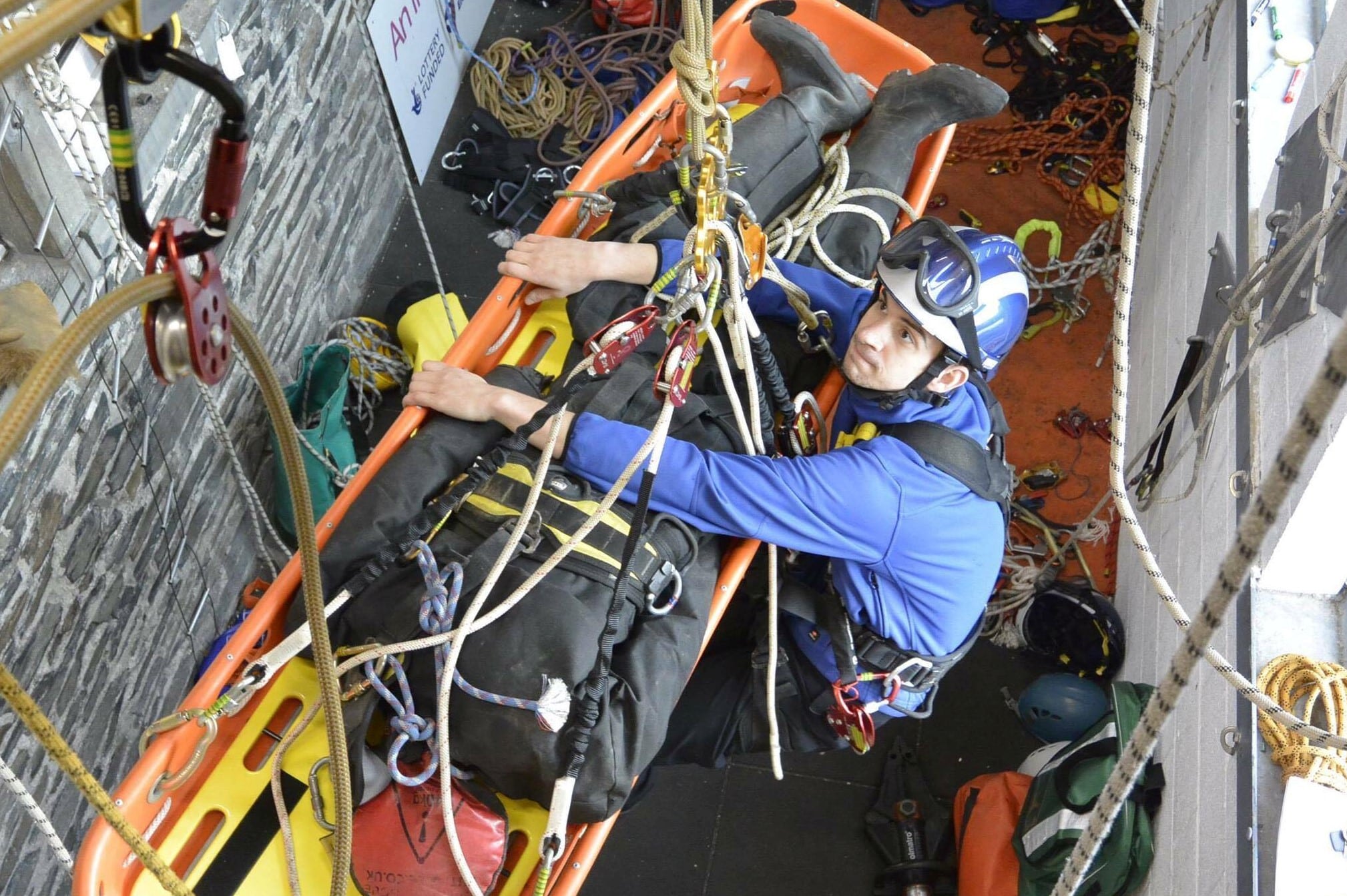 Rescue worker training with an injured person.