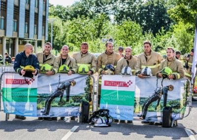 Firefighters group posing at Ruth Lee event.