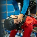 Rescue training on mannequin with safety gear.