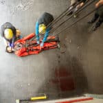 Emergency responders performing rescue operation indoors