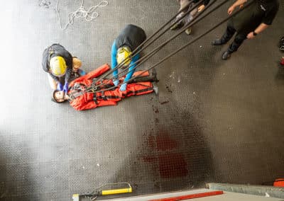 Emergency responders performing rescue operation indoors