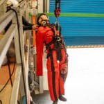 Person in harness during rescue training exercise