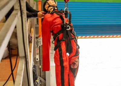 Person in harness during rescue training exercise